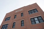 The brick facade of the Sundial Building.