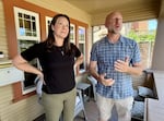 Kate Huckert and her boyfriend Mike Servant on the porch of her home, which is across the street from the city's newest homeless camp.