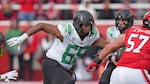 Oregon offensive lineman Ajani Cornelius (65) defends during the second half of an NCAA college football game against Utah Saturday, Oct. 28, 2023, in Salt Lake City. 