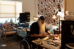 Norris works on woodworking projects and art drawings. He takes five or six medications a day and goes to a wound care facility three times a week, a preventative regiment he says he never could have maintained while living in a tent.