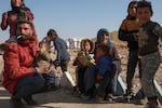 Internally displaced people sit in a camp in Tabqa city, Raqqa governorate, northern Syria, on Wednesday, Dec. 4, 2024. Thousands of Kurdish families displaced from Aleppo and Tel Rifaat have ended up in temporary shelters and on the streets in Kurdish-controlled areas of Tabqa city.