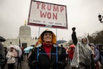 FILE: In this Jan. 6, 2021 file photo, a supporter of President Donald Trump gathers to protest in solidarity in Salem, Ore.