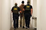 Federal agents detain a man after his court hearing in immigration court at a federal building in New York City on July 9, 2025. The federal government's push to collect data on nutrition assistance recipients has advocates worried that the government safety net programs will be harnessed for immigration enforcement.