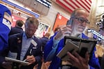 Traders Robert Charmak, left, and Mark Puetzer work on the floor of the New York Stock Exchange, Thursday, June 25, 2026.
