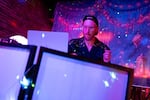 Yosef Rosen, known as DJ Bambi, plays tracks at a Hanukkah rave, the night before the first evening of the Jewish holiday, at the Barrel Room in Portland, Ore., on Dec. 13, 2025.