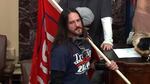 In this image from U.S. Capitol Police video, Paul Hodgkins of Tampa, Fla., stands in the well on the floor of the U.S. Senate on Jan. 6. On Monday he was sentenced to eight months in prison.