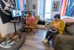 Marcieline Novatore, left, and her partner Eloise Zana in their Northwest Portland home, Jan. 22, 2024.