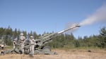 Soldiers at JBLM practice shooting a howitzer, which fires shells a distance of six miles