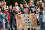 Opponents of a proposed camping ban protest outside of Portland City Hall, May 31, 2023. 