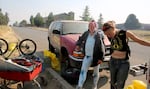 Michelle Hester (left) and Savage stand on Clausen Road in Bend, where crews finished removing tents and RVs on Thursday, July 27, 2023. Savage's trailer was among the last remaining.