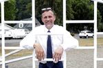 Marc Thielman, a candidate for Oregon governor, poses for a portrait on the school campus in Alsea, Ore.