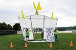 Demonstrators protested the arch with a replica of their own in Virginia in May.