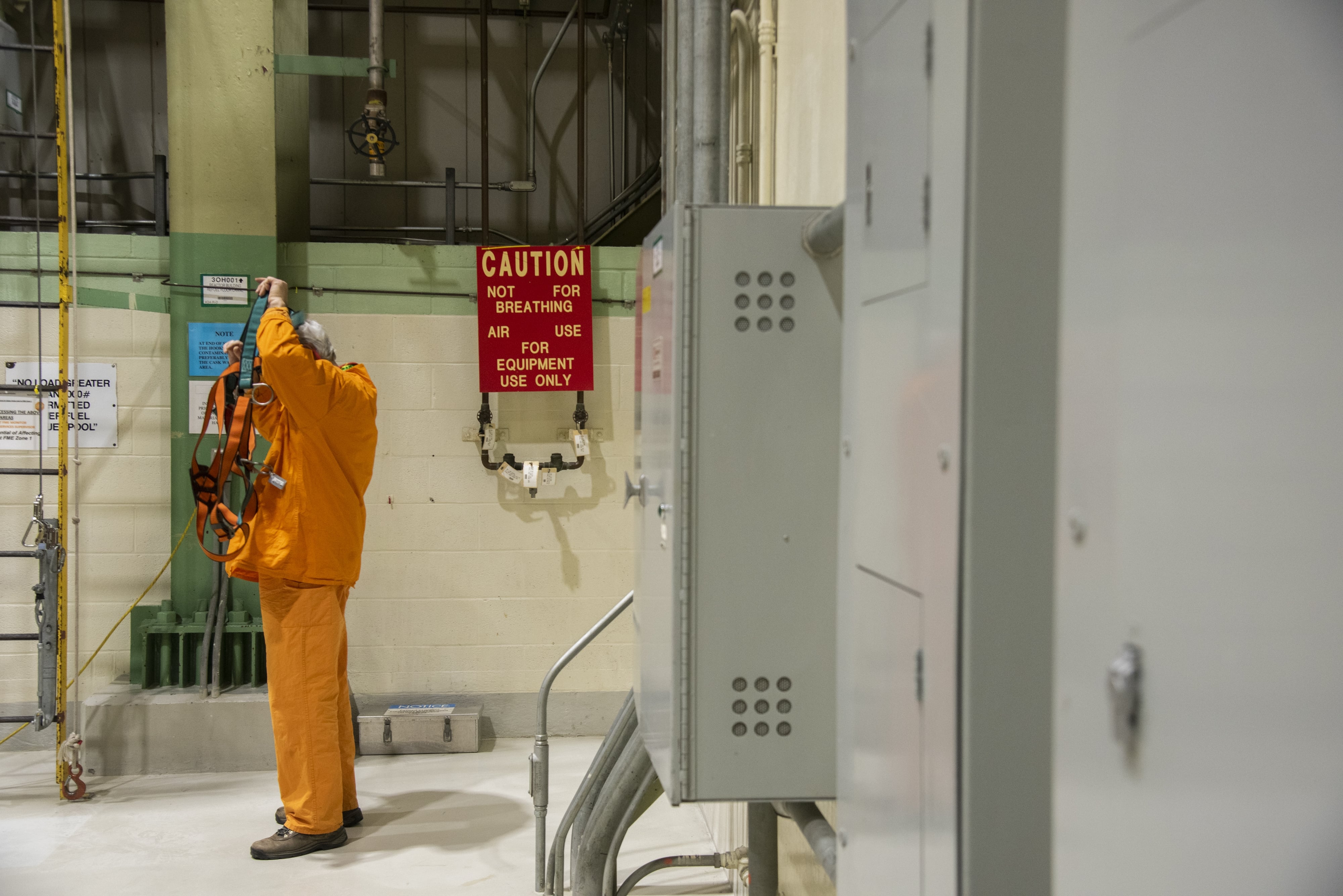 A worker dons safety equipment at the Peach Bottom nuclear plant in Delta, Pennsylvania, U.S., on Tuesday, Feb. 19, 2019. The NRC sets radiation safety standards for nuclear workers and the public.