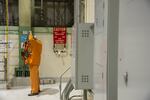 A worker places dons safety equipment at the Peach Bottom nuclear plant in Delta, Pennsylvania, U.S., on Tuesday, Feb. 19, 2019. The NRC sets radiation safety standards for nuclear workers and the public.