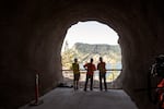 An ODOT crew inspect one of the new windows at Mitchell Point Tunnel.