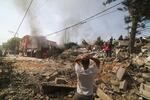 Palestinians look for survivors of the Israeli bombardment of the Gaza Strip in Rafah on Monday.