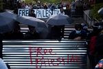 The east entrance to the University of Washington Quad and encampment for Palestine is shown barricaded following a talk by Turning Point USA founder Charlie Kirk at UW's HUB on Tuesday, May 7, 2024, in Seattle.