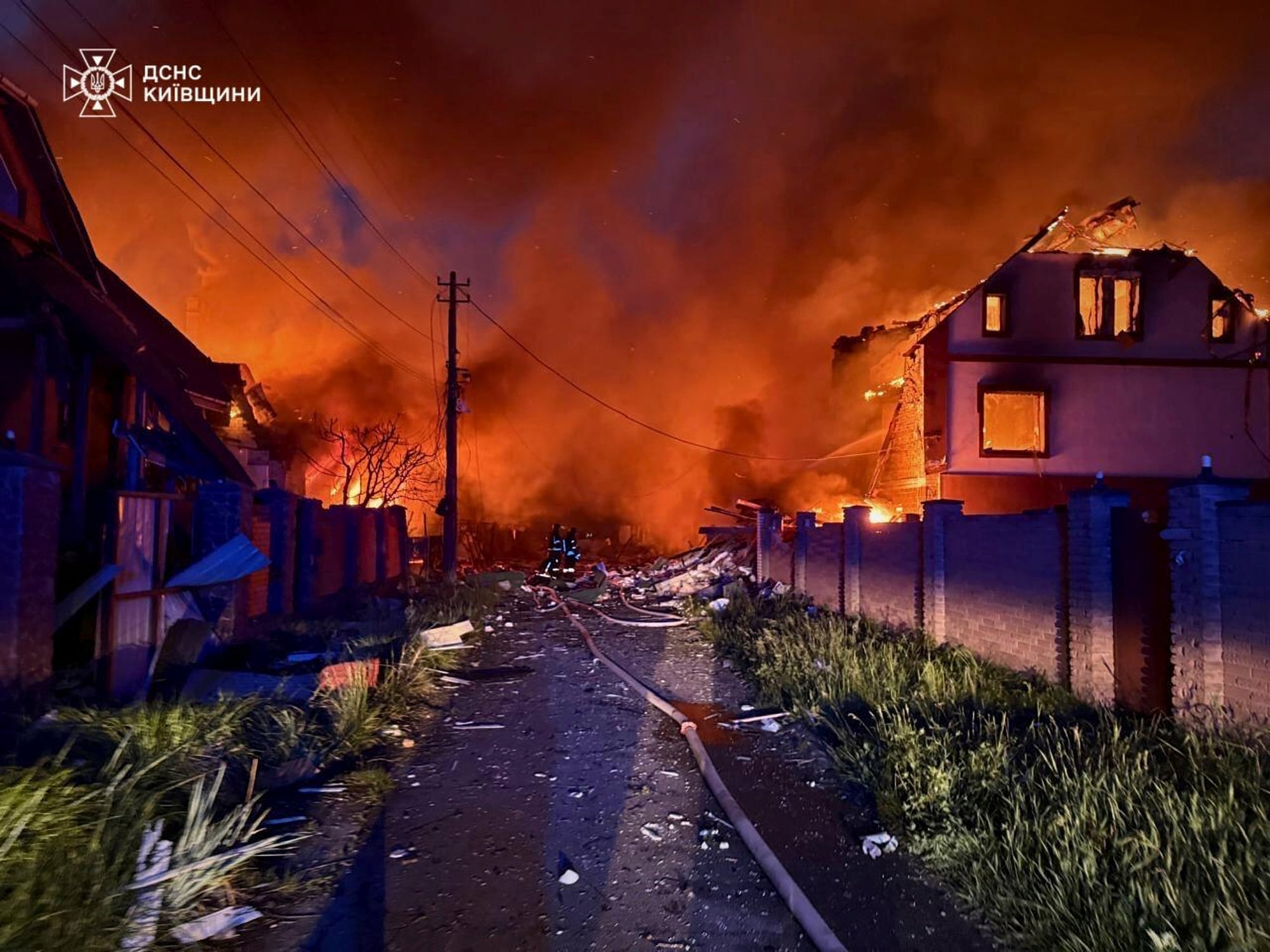 In this photo provided by the Ukrainian Emergency Service, firefighters try to put out a fire following a Russian attack in Kyiv region, Ukraine, Sunday, May 25, 2025.