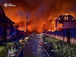 In this photo provided by the Ukrainian Emergency Service, firefighters try to put out a fire following a Russian attack in Kyiv region, Ukraine, Sunday, May 25, 2025.