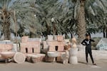 A Palestinian child sells planters and pottery along the road approaching the Dead Sea in the Israeli-occupied West Bank.