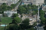 Construction cranes are seen, from the Washington Monument, on the site of the former East Wing of the White House on April 17, 2026 in Washington, DC.
