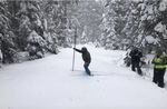 Austin Patch, assistant watermaster for the Oregon Water Resources Department, takes a snow core sample Monday, Feb. 27, 2023, at the Ski Bowl Road snow course in Southern Oregon. Snowpack at the site is 88% of median as of March 1.