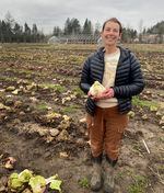 Mary Colombo holds a Variegato di Chioggia on her farm in Troutdale, Oregon.  on January 25th. 2023. They grow more than 25 varieties of radicchio at Wild Roots which Colombo owns with husband Brian Shipman.