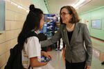 Oregon Gov. Kate Brown talks with a student at Madison High School in Portland.