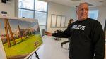 Alan Evans shows off a rendering of his vision for Wapato Jail. 