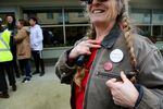A woman displays a "Boycott Burgerville" pin in support of efforts to form a Burgerville Workers Union.