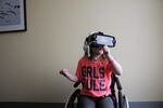 Six-year-old Moira Reeves from Baker City, Oregon, uses a virtual reality headset at the Legacy Oregon Burn Center in Portland.