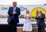 President Donald Trump arrives to deliver remarks on the "Farmers to Families Food Box Program" at Flavor First Growers and Packers, Monday, Aug. 24, 2020, in Mills River, N.C. Ivanka Trump, center and Agriculture Secretary Sonny Perdue, right, applaud.