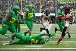 Oregon State Beavers running back Jermar Jefferson (22) breaks a tackle at Autzen Stadium in Eugene, Oregon, on Nov. 30, 2019. The Pac-12 voted Tuesday, Aug. 11, 2020, to cancel fall sports due to COVID-19.