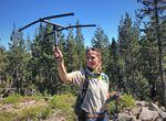 Wildlife biologist Jamie Bowles uses radio telemetry to track a Sierra Nevada red fox that she previously captured and collared with a radio transmitter. Bowles is a biologist at the Oregon Department of Fish & Wildlife who become one of Oregon’s leading experts on the endangered and rare Sierra Nevada red fox.
