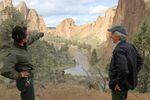 Ranger Josie Barnum and park director Scott Brown survey the valley in Smith Rock State Park. The park already sees crowds of at least 2,000 visitors on a weekend day. During the solar eclipse, there could be double or triple the visitor volume.