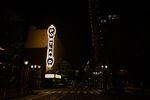 The Portland sign on Arlene Schnitzer Concert Hall lights up an empty street Saturday, April 18, 2020, in Portland, Ore. Oregon Gov. Kate Brown banned large gatherings in March to slow the spread of COVID-19.