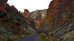 Leslie Gulch in Southeastern Oregon features sheer rock walls and red rock formations.