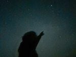 An amateur astronomer points in the direction of a celestial object under exceptionally dark skies at Cherry Springs State Park in northern Pennsylvania earlier this month.