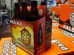 Double Mountain's new six-pack has a label letting customers know the bottles inside are refillable. The bottles themselves also have the word "refillable" stamped into the glass.