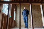 Housing developer Justin Wood, at one of his construction projects in Southeast Portland, April 12, 2023. Wood’s company focuses on building new homes for people living at or below median income levels. 