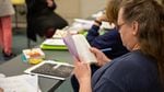 A student in PSU's new "Metamorphosis" class at Coffee Creek Correctional Facility looks through a journal back in October. The 15-credit general education course was offered for the first time this year -- because of COVID-19, the class is ending differently than it started.
