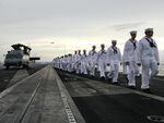 Sailors are seen aboard the USS George Washington in Yokosuka, Japan, in 2011. The U.S. Navy has seen a spike in desertions, with numbers more than doubling from 2019 to 2021. 