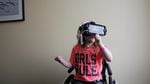 Six-year-old Moira Reeves from Baker City, Oregon, uses a virtual reality headset at the Legacy Oregon Burn Center in Portland.