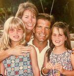 Audrey, left, and Kelsey referred to each other as "wombie," short for wombmate. The two were inseparable in their youth, and remained close when they grew older. They are seen with their parents Janine and Scott Ellis.