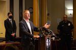 Mayor Ted Wheeler, Police Chief Chuck Lovell and District Attorney Mike Schmidt speak at a press conference Aug. 30, 2020, in Portland, Ore. 