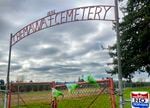 The gate to the Chemawa Cemetery is locked and adorned with flowers on March 22, 2022.
