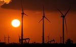 FILE -Wind turbines produce power during sundown in Emlichheim, Germany, Friday, March 18, 2022. The head of the International Renewable Energy Agency says “radical action” is needed to ensure global warming doesn't pass dangerous thresholds, warning that greenhouse gas emissions are heading in the wrong direction.(AP Photo/Martin Meissner,file)
